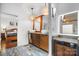 Bathroom with dual sinks and wood cabinet, granite countertop, stylish lighting and view to the main bedroom at 406 Third Ne Ave, Conover, NC 28613