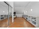 An ample bonus room with hardwood floors, ample shelving, natural light, and closet with mirror doors at 406 Third Ne Ave, Conover, NC 28613