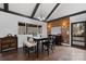 Bright dining room with hardwood floors, wooden accent wall, large window and stylish lighting at 406 Third Ne Ave, Conover, NC 28613
