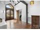 Inviting foyer featuring wood floors, a stunning front door, and a glimpse into the office at 406 Third Ne Ave, Conover, NC 28613