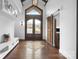 Bright foyer with high ceilings, hardwood floors, a wooden door, and white cabinets at 406 Third Ne Ave, Conover, NC 28613