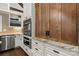 This kitchen features stainless steel appliances, wood cabinets, and granite countertops at 406 Third Ne Ave, Conover, NC 28613