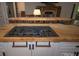 Close up of a kitchen island featuring a built-in gas stovetop on a live edge countertop at 406 Third Ne Ave, Conover, NC 28613
