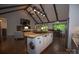 Open-concept kitchen with live edge island, hardwood floors, and views of the living and dining area at 406 Third Ne Ave, Conover, NC 28613