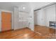 A bright kitchenette features white cabinetry, subway tile backsplash, hardwood floors and stainless appliances at 406 Third Ne Ave, Conover, NC 28613