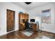 A home office features a wood desk, cabinets, hardwood floors, and a window for natural lighting at 406 Third Ne Ave, Conover, NC 28613