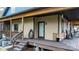 Inviting covered porch showcasing stone accents, wood flooring, and exterior lighting at 406 Third Ne Ave, Conover, NC 28613