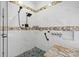 Stylish shower with glass door, tiled walls, shower head, and toiletries at 406 Third Ne Ave, Conover, NC 28613
