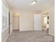 Bedroom features neutral carpet, a walk-in closet and a door leading to a bathroom at 417 Baker Street Ext, Rock Hill, SC 29730