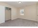 Bedroom features neutral carpet, a window, and a walk-in closet at 417 Baker Street Ext, Rock Hill, SC 29730