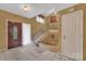 Foyer with tile flooring, staircase, and unique brick feature at 4504 Meridian Dr, Charlotte, NC 28216