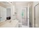 Bright bathroom with large mirror, vanity, and tile flooring at 537 Southeast Dr # 537, Davidson, NC 28036