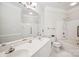 Clean bathroom featuring a double vanity, large mirror, and a tub-shower combo at 537 Southeast Dr # 537, Davidson, NC 28036