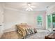 Cozy bedroom with neutral carpet, a queen-sized bed, and outdoor balcony access at 537 Southeast Dr # 537, Davidson, NC 28036