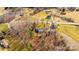 An aerial shot showcasing the property's layout, including the house, surrounding land, and nearby road at 6000 George Hildebran School Rd, Hickory, NC 28602