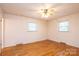 Bedroom with hardwood floors, natural light, and neutral color palette at 6000 George Hildebran School Rd, Hickory, NC 28602