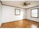 Bright bedroom with hardwood floors, two windows, and neutral walls at 6000 George Hildebran School Rd, Hickory, NC 28602