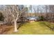 Charming brick home with a well-maintained lawn, mature trees, and a welcoming front porch at 6000 George Hildebran School Rd, Hickory, NC 28602
