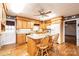 Cozy kitchen with wooden cabinetry, granite countertops, and an island with seating at 6000 George Hildebran School Rd, Hickory, NC 28602