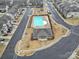 Aerial view of community pool, showcasing a large pool area with lounge seating and clubhouse at 6814 Piper Thorn Way, Indian Land, SC 29707