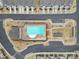 An aerial shot of the large pool featuring a lounge area, umbrellas, and a clubhouse at 6814 Piper Thorn Way, Indian Land, SC 29707