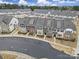 A well-planned community features townhomes and green spaces creating an inviting and vibrant neighborhood at 6814 Piper Thorn Way, Indian Land, SC 29707