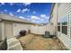 A private backyard features a small lawn, grill, and a crisp white privacy fence at 6814 Piper Thorn Way, Indian Land, SC 29707