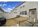 Backyard with white fence, showing the exterior of a home at 6814 Piper Thorn Way, Indian Land, SC 29707