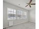 Bright bedroom with three windows and a ceiling fan at 6814 Piper Thorn Way, Indian Land, SC 29707
