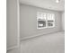 Inviting bedroom featuring a large window offering plenty of natural light at 6814 Piper Thorn Way, Indian Land, SC 29707