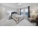 Bright bedroom featuring a comfy bed, natural light from windows, and neutral decor at 6814 Piper Thorn Way, Indian Land, SC 29707