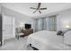 Bedroom featuring a ceiling fan, decorative curtains, and a dresser with a television at 6814 Piper Thorn Way, Indian Land, SC 29707