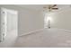 Large bonus room featuring neutral carpet and a ceiling fan at 6814 Piper Thorn Way, Indian Land, SC 29707