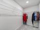 Walk-in closet with white wire shelving for organized storage of clothes and accessories at 6814 Piper Thorn Way, Indian Land, SC 29707