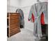 Walk-in closet with wire shelving and a wooden chest of drawers at 6814 Piper Thorn Way, Indian Land, SC 29707