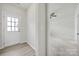 Inviting entryway with a white door and light wood-look floors at 6814 Piper Thorn Way, Indian Land, SC 29707