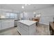 Contemporary kitchen featuring white cabinets and a center island at 6814 Piper Thorn Way, Indian Land, SC 29707