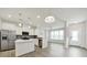 Modern kitchen featuring stainless steel appliances and a center island that is bathed in natural light at 6814 Piper Thorn Way, Indian Land, SC 29707
