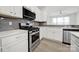 Modern kitchen featuring stainless steel appliances including a gas range and microwave at 6814 Piper Thorn Way, Indian Land, SC 29707