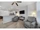 Open-concept living area with comfortable seating and adjacent kitchen at 6814 Piper Thorn Way, Indian Land, SC 29707