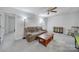Spacious living room featuring neutral walls, carpet, ceiling fan, lamps and natural light at 6814 Piper Thorn Way, Indian Land, SC 29707