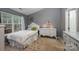 Cozy bedroom with carpet, a bed, and natural light through the windows at 706 Cherryfield Pl, Rock Hill, SC 29732