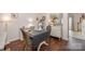 Charming dining area adjacent to the living room featuring hardwood floors and neutral decor at 706 Cherryfield Pl, Rock Hill, SC 29732