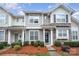Charming townhome with stone accents, manicured landscaping, and a welcoming front entrance at 706 Cherryfield Pl, Rock Hill, SC 29732