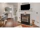 Elegant living area featuring a fireplace, hardwood floors, and an open layout at 706 Cherryfield Pl, Rock Hill, SC 29732