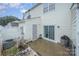 View of an enclosed patio with sliding glass doors, a side door, and white vinyl lattice at 706 Cherryfield Pl, Rock Hill, SC 29732