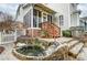 Charming backyard featuring a lovely fish pond, stone patio, and screened-in porch at 7541 Thorn Creek Ln, Tega Cay, SC 29708