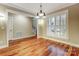 Living room with hardwood floors and views through adjoining rooms at 7541 Thorn Creek Ln, Tega Cay, SC 29708