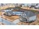 Community aerial view featuring a pool, sidewalks, and traditional homes on landscaped lots at 8651 Shadetree St, Huntersville, NC 28078