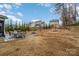 Spacious backyard featuring a patio with an outdoor dining set and fire pit at 8651 Shadetree St, Huntersville, NC 28078